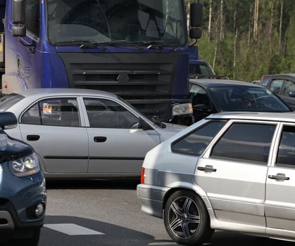 collision of the truck and car on a busy road