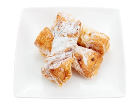 dish of sweet puff pastry filled with cream cut and isolated