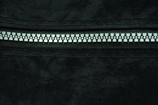 Zipper on black background.