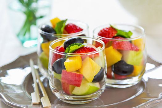 Varieties of fruits salad in small glasses