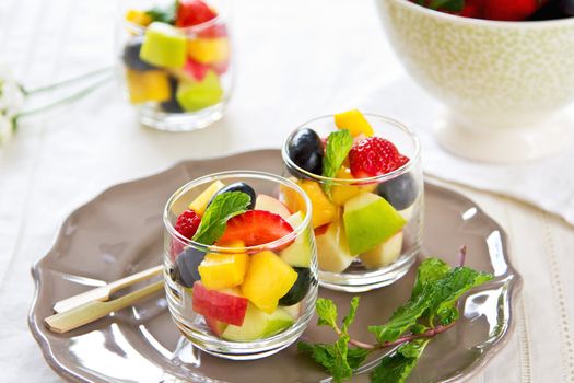 Varieties of fruits salad in small glasses