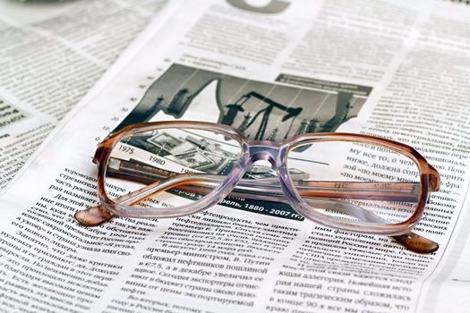 reading glasses lying on the paper as a background