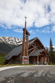 A log construction church sits in a remote Alaska town