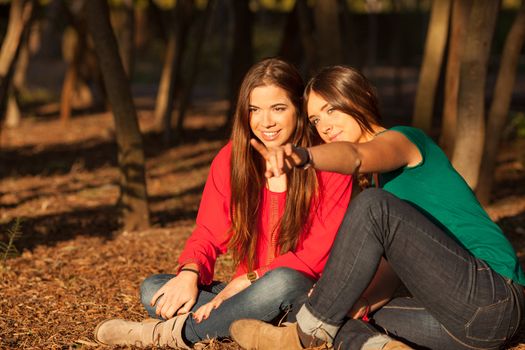 young girlfriends playing and having fun on a park