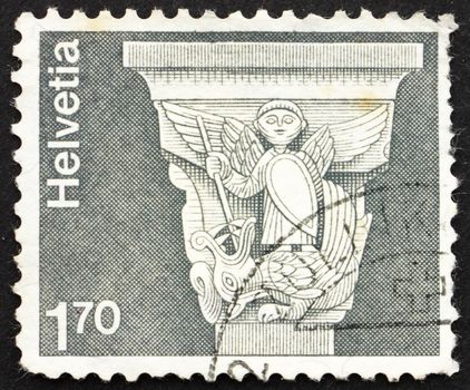 SWITZERLAND - CIRCA 1973: a stamp printed in the Switzerland shows Romanesque Capital, St. George and Dragon, St. Jean Baptiste, Grandson, Switzerland, circa 1973