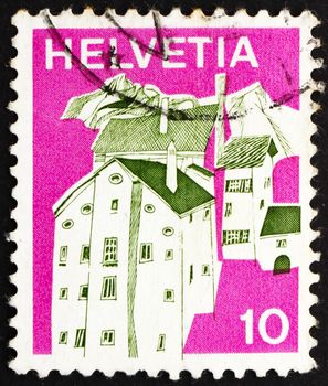SWITZERLAND - CIRCA 1973: a stamp printed in the Switzerland shows Village in Graubunden, Switzerland, circa 1973