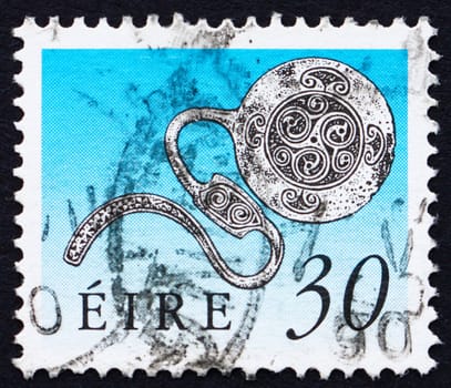 IRELAND - CIRCA 1990: a stamp printed in the Ireland shows Enamel Latchet Brooch, Art Treasure of Ireland, circa 1990