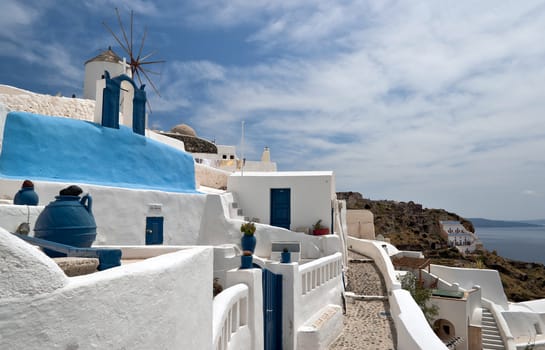 Santorini buildings: houses, church, windmil, walls and staircases
