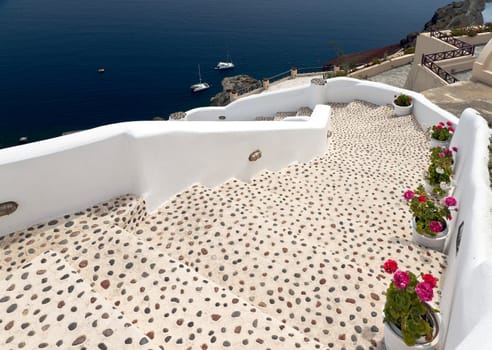 Sea view in Santorini island with leopard staircase to the buildings on the cliff