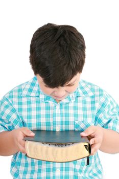 portrait of a boy with a Bible in hand and prayed