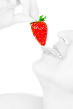 Young girl eat strawberry isolated