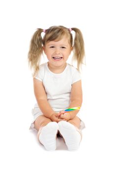 Small smiling girl with lollipop isolated