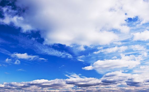 Cloudy summer midday blue sky