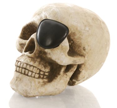 pirate skeleton - human skull with eye patch on white background