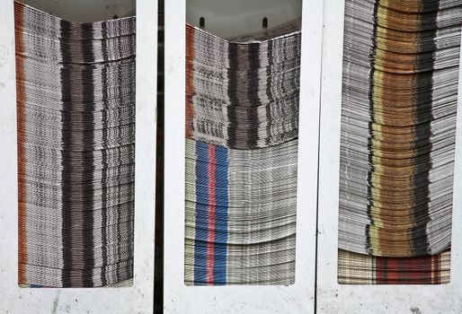 Stack of newspapers in the street