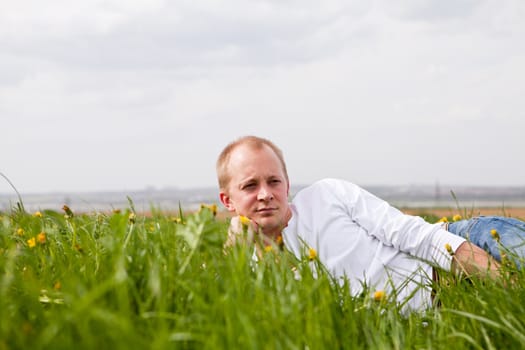 young man outdoor in summer in nature happy