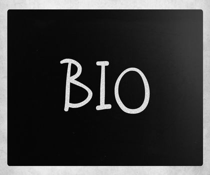 "Bio" handwritten with white chalk on a blackboard.