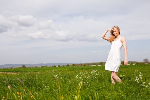 beautiful blonde woman outdoor in summer happy