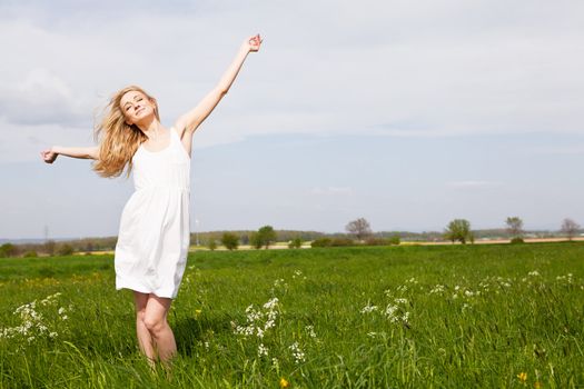 beautiful blonde woman outdoor in summer happy