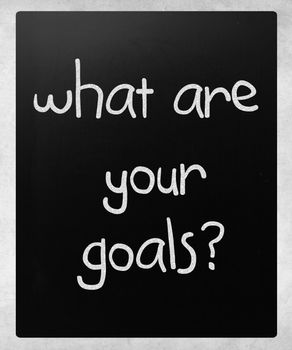 "What are your goals?" handwritten with white chalk on a blackboard