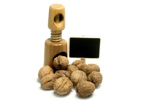 wooden nutcracker isoalted on white with walnuts