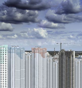 darkness clouds gathering over building construction at summer