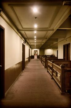 hallway with rooms inside a rough old hotel