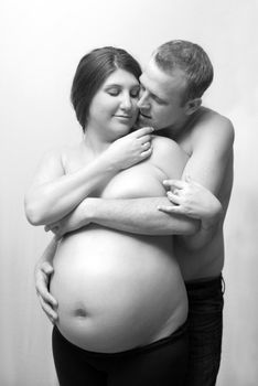 An intimate portrait of a couple who are having their first born child.