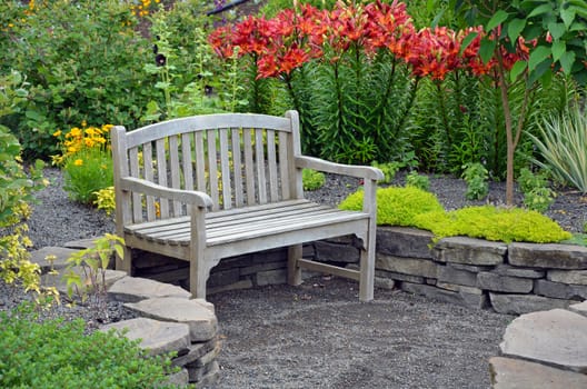 Wooden bench in lily flower garden