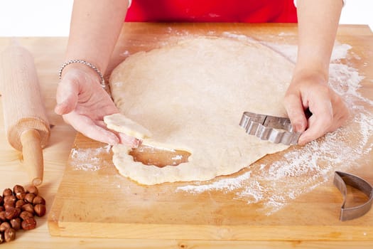 beautiful woman is baking cookies for christmas isolated