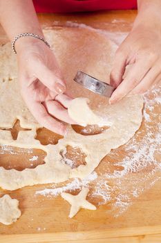 beautiful woman is baking cookies for christmas isolated