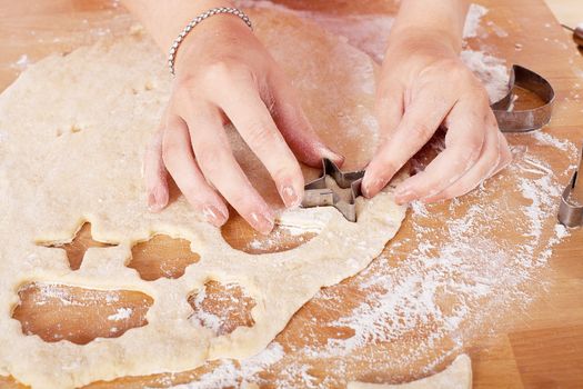 beautiful woman is baking cookies for christmas isolated