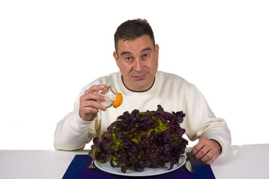 Pouring salt on a boring, raw lettuce, diet concept