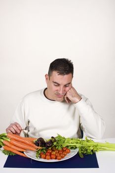 A lot of vegetables, not the food he wants