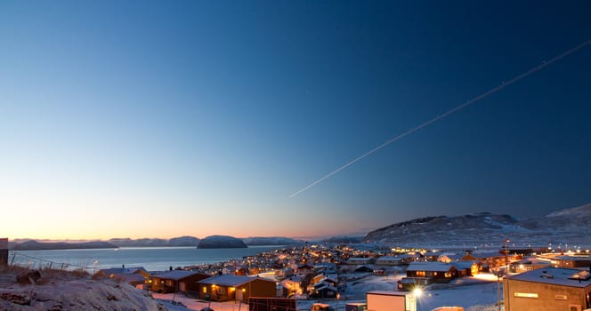 Picture of a part of the  northermost city in the world, Hammerfest. The sun is just in the horizon during day time