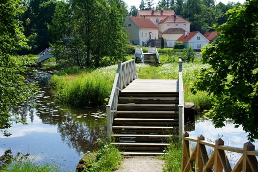 Way on manor through a stream and the bridge