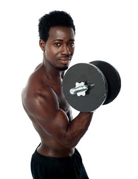 Muscular african guy doing biceps exercise isolated over white