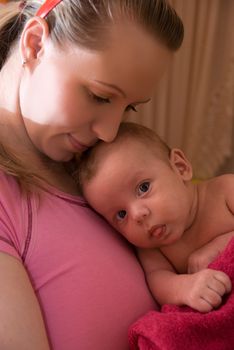 Happy maternity: mother with her baby boy 