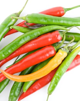 red and green hot chili peppers isolated on white