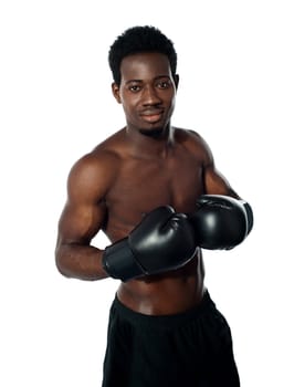 Muscular african boxer posing in style isolated against white background