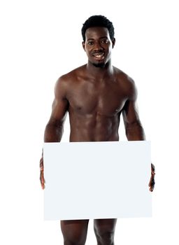 Naked black man holding blank billboard isolated against white background