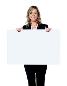 Female executive showing blank advertising board isolated over white background