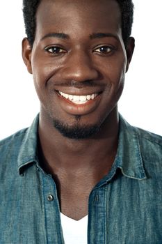 Closeup portrait of smiling black teenager. Cropped image