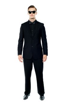 Full length portrait of young man wearing goggles. Posing in style