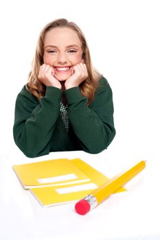 Isolated girl smiling with hands on chin. All on white background