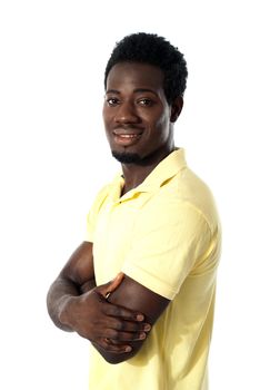 Young happy man posing with crossed arms in front of camera