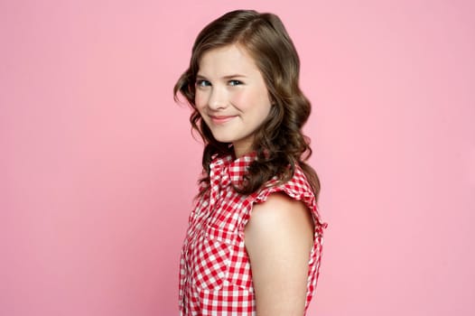 Portrait of smiling cheerful teenager looking at camera