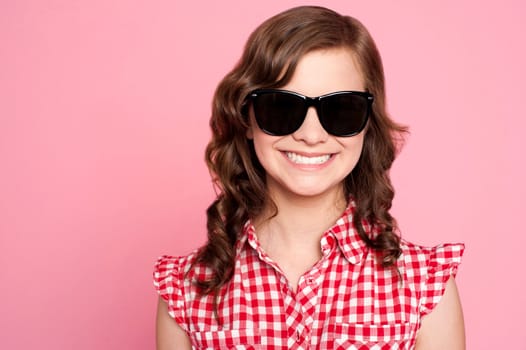 Closeup portrait of trendy young girl in black goggles