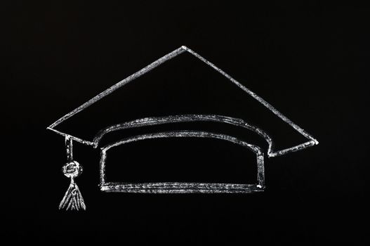 Trencher cap for graduation concept drawn with chalk on a blackboard background