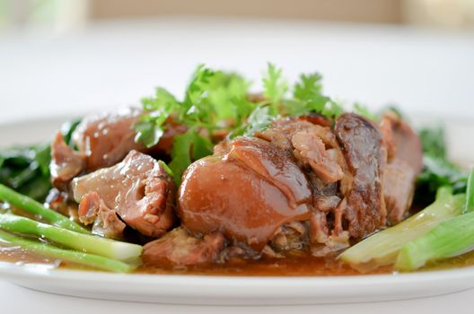 chinese food , stewed pork knuckle with kale inside